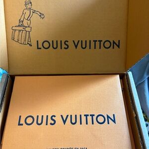 Iconic LV shopping bags w/ Blue ribbon.